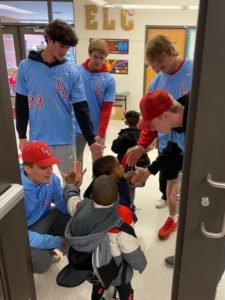 Baseball players greeting students inside the Early Learning Center