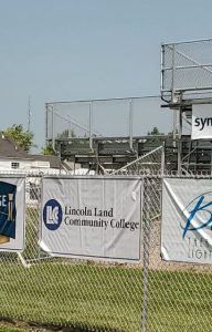 LLCC banner on fence at Sangamon County Fair grandstand