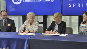 Dr. Warren and Dr. Gooch signing the agreement