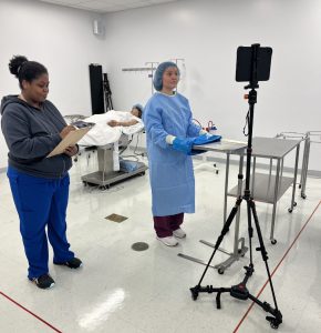 Students using the iPad on a mobile tripod in the surg tech lab