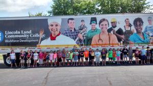 Youth pictured in front of LLCC truck