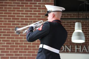 Lance Corporal Bobby Herpel playing "Taps"