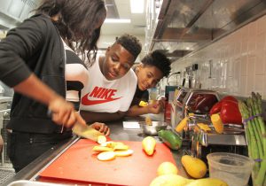 Career Launch teens cutting vegetables