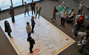 LLCC student activity on giant floor map of Illinois