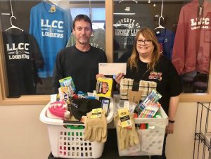 Ed Legg with Missions for Taylorville and Dee Krueger, director, LLCC-Taylorville with items given at donation drive