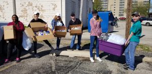 Education student loading up donations to take to St. John's Breadline