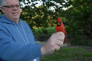 Tony Rothering holding cardinal