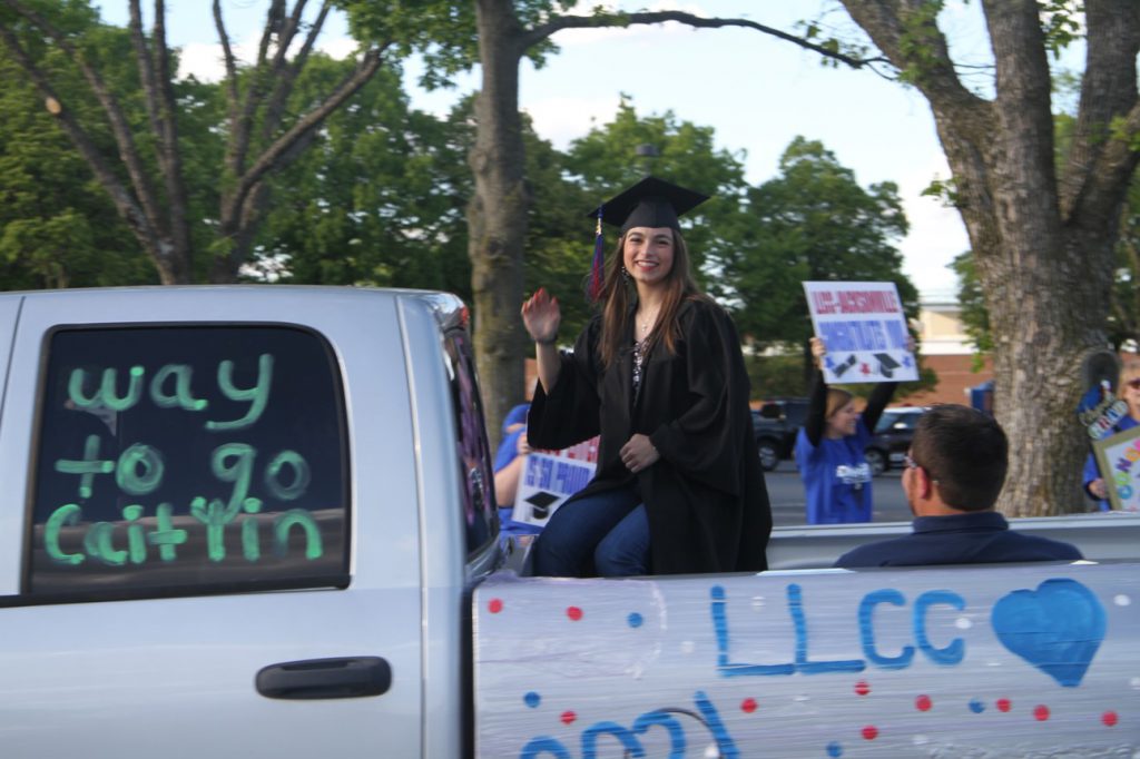 Graduate in truck at parade