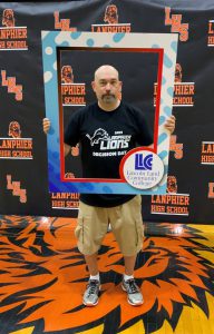 Lanpher staff member holding LLCC frame