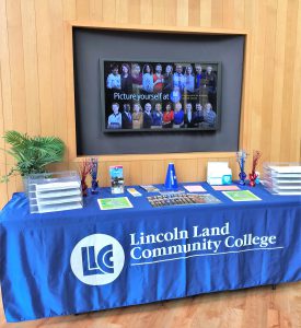 Lincoln Land Community College Welcome Week table summer 2021 with information and handouts.