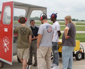 Prospective students learning about aviation