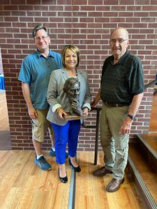Ryan Roberts, Karen Sanders (holding Lincoln sculpture) and John McClarey 