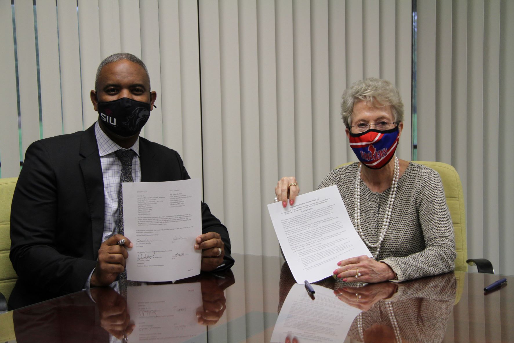 Photo of Dr. Austin Lane and Dr. Charlotte Warren after hey signed the Saluki Step Ahead agreement 