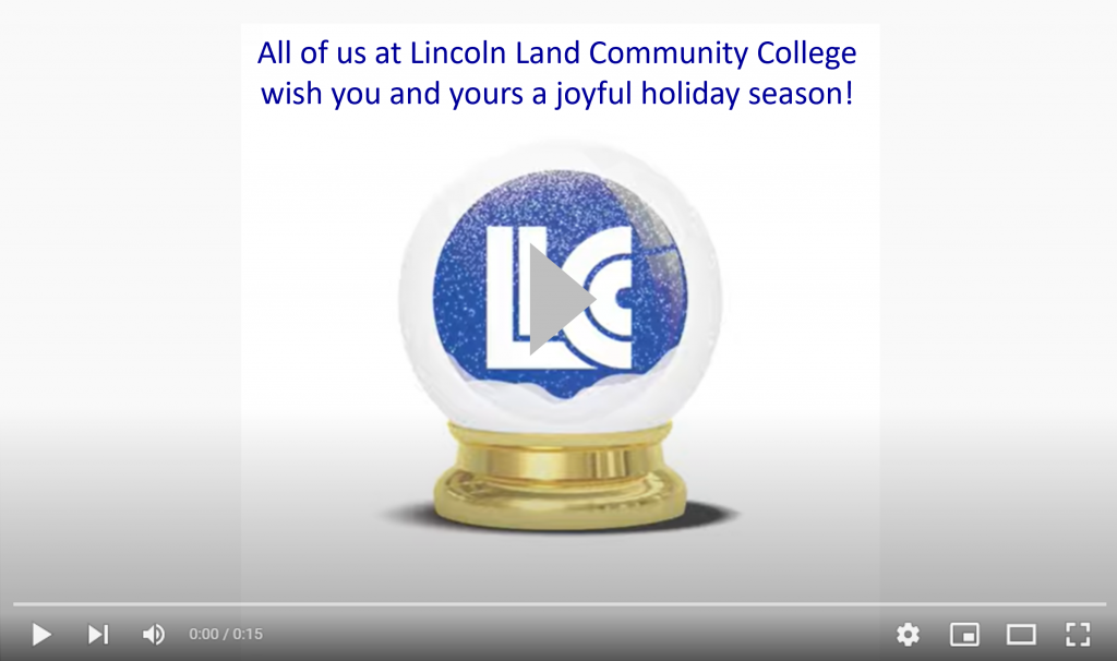 Video preview screen with play button. Shows LLCC logo in a snow globe and "All of us at Lincoln Land Community College wish you and yours a joyful holiday season!"