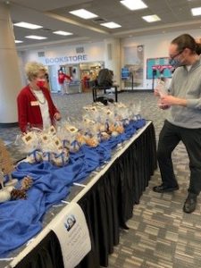 Dr. Warren handing out popcorn and cake