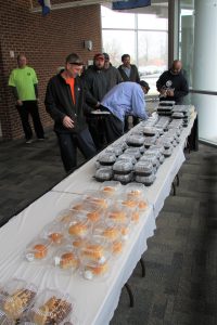 Facilities staff enjoying free meal from anonymous donors