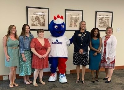 From left to right: Raven Horsthemke (DMS Lab Instructor), Alli Richards (graduate), Shelia Jack (graduate), Linc, Leigh Giles-Brown (DMS Program Director), Iyerusalem Dollar (graduate), Ann Neilson (DMS Clinical Coordinator)