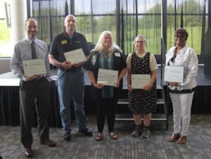 15-year service anniversary honorees with their certificates