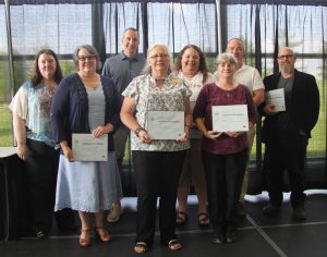 20-year service anniversary honorees with their certificates