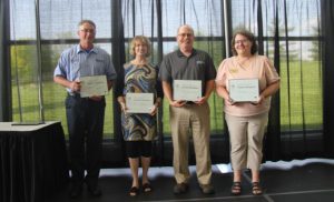 25-year service anniversary honorees with their certificates