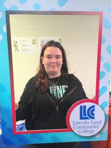 Lanphier student holding an LLCC frame