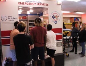 Nick Ferreira talking showing students the ambulance simulator