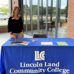 Lori Smith at Welcome Week table in the Kreher Agriculture Center