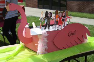 Boat entry from Foundation. A pink swan name Ophi with small cutouts of team members.