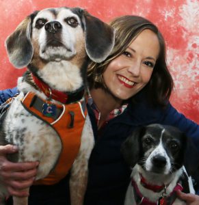 Amanda pictured with two dogs