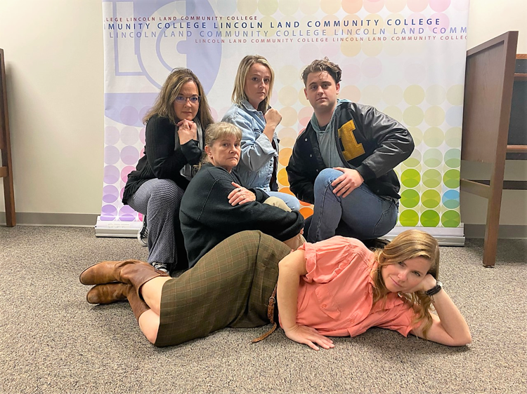 LLCC-Jacksonville staff posing in front of LLCC backdrop as characters from The Breakfast Club