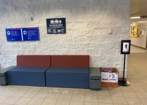 Food Pantry box next to seating along wall across from main entrance in Millennium Center