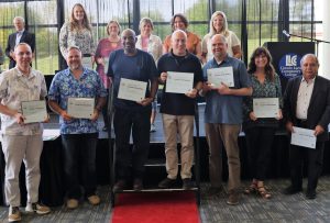 12 members of 20-year service anniversary group