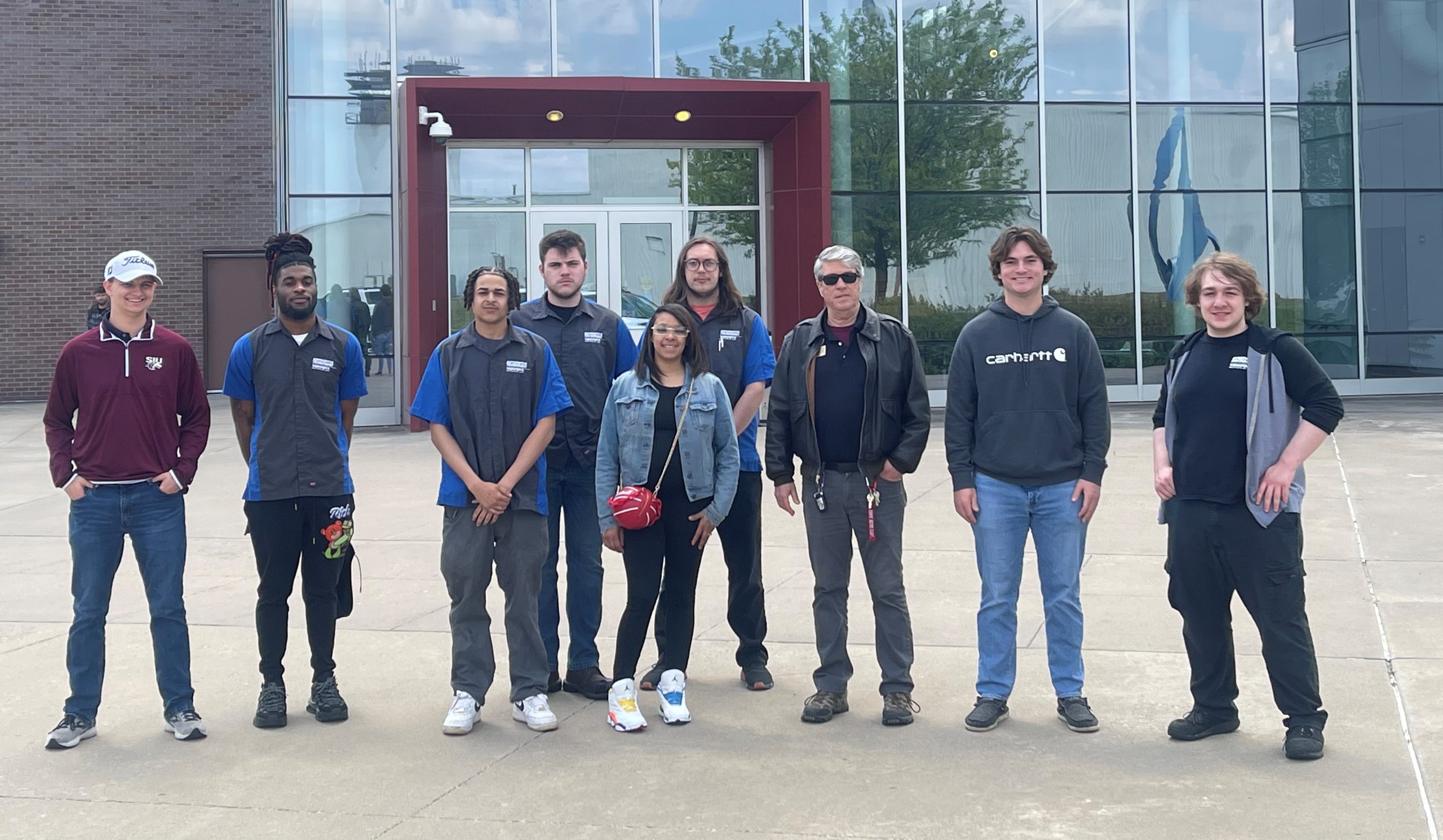 Eight LLCC student and Dave Pietrzak in front of Transportation Education Center building