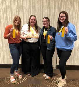 Four LLCC Radiography students, each holding a fourth place ribbon
