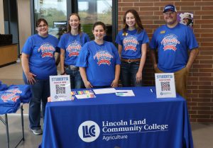 LLCC staff at Ag Expo welcome table