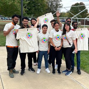 Nine students with Multicultural Fest T-shirts