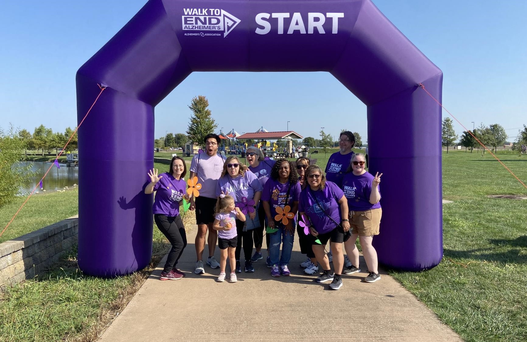 Team Loggers poses for a funny photo at the Walk to End Alzheimer’s start line. L to R: Leslie Johnson, DeAngelo Thompson, Kassie Thompson, EllianaThompson, Bobbi Henry, Laurie Clemons, Karen Sanders, Marina Wirsing, Kirk Yenerall, and Carley Young. 