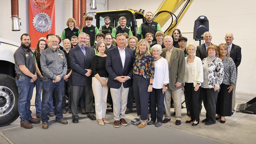 Members of the Roland Machinery Co. family pose with LLCC officials and diesel technologies students.