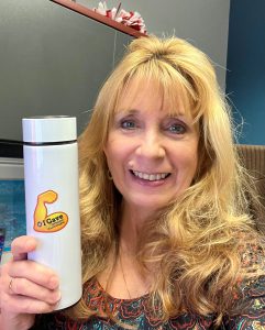 selfie photo of Diane Wilson holding cup with "I Gave" emoji sticker 