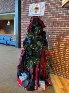 Giving Tree decorated with hats and gloves