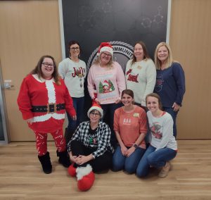 Nursing faculty and staff dressed in ugly holiday sweaters