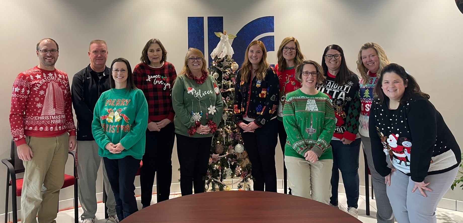 Photo of Student Services staff in ugly holiday sweaters