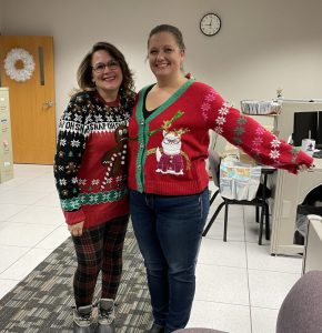 Sarah and Marg wearing ugly holiday sweaters