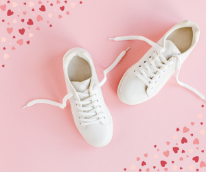 White sneakers on a pink Valentine background.