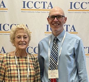 Dr. Charlotte Warren and Matthew Shaver in front of ICCTA backdrop
