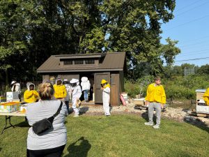 West Lake Nature Grove volunteers in beekeeper suits.