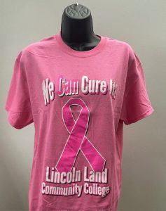 Pink tshirt with the words, We Can Cure It! Lincoln Land Community College.