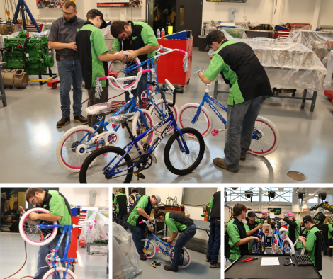 Workforce Diesel students assembling pink and blue bicycles as a volunteer project.