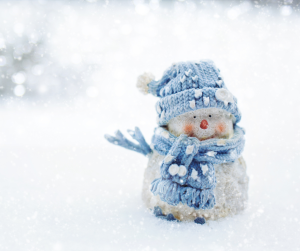 snowman figurine in the snow.