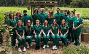 LLCC Rad Tech students posing for a group photo in green scrubs.